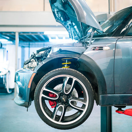 MINI R53 GP on a ramp with bonnet open ready for servicing