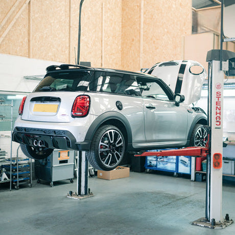 F-series MINI on a ramp for a service and MOT